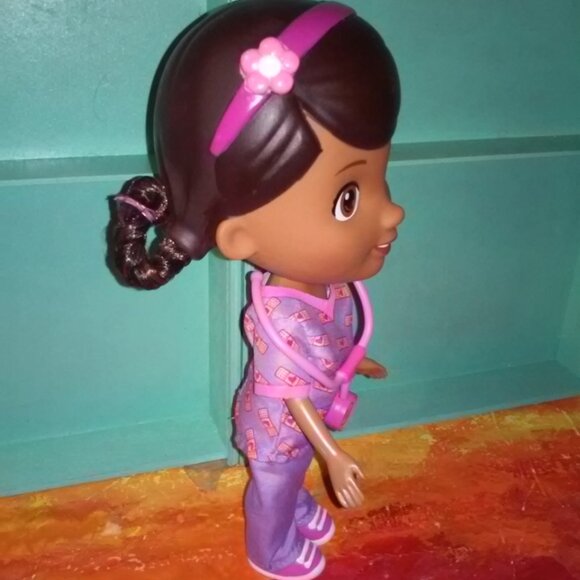 Doc Mcstuffins Doll in purple & pink  scrubs with a mini doc - Picture 5 of 8